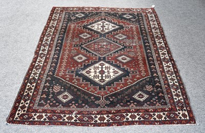 Lot 1201 - An Afshar rug, the indigo field with stepped...