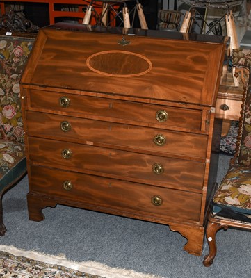 Lot 1276 - A George III walnut and mahogany bureau, the...