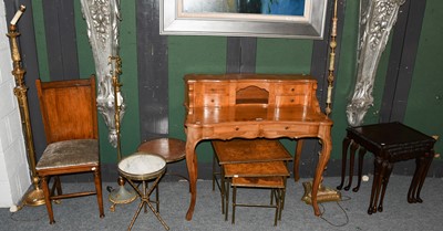 Lot 1252 - A reproduction light walnut desk, crossbanded...