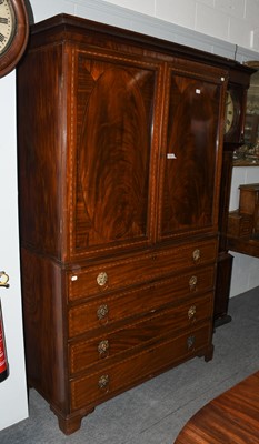 Lot 1102 - A George III mahogany press cupboard with...