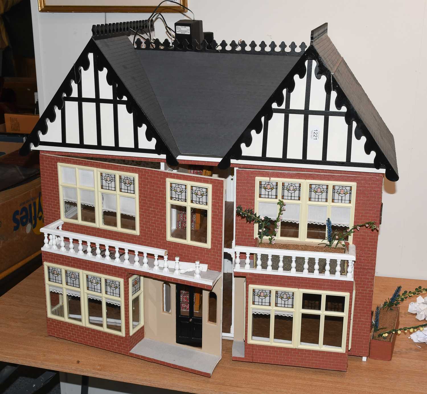 Lot 1221 - A modern mock Tudor double fronted dolls house...