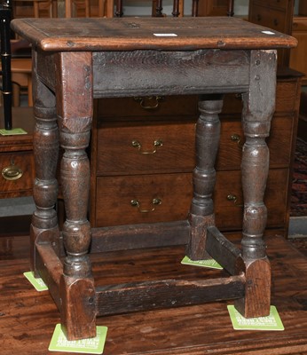 Lot 1152 - An 18th century oak joint stool with moulded...