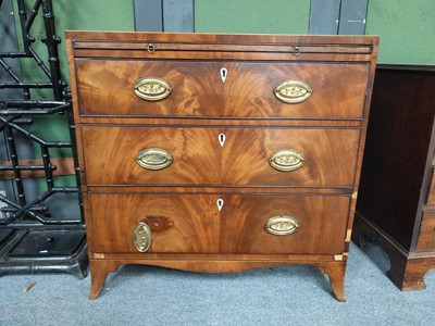 Lot 1182 - A George III mahogany bachelors chest of three...