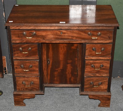 Lot 1183 - A George III mahogany kneehole dressing table,...