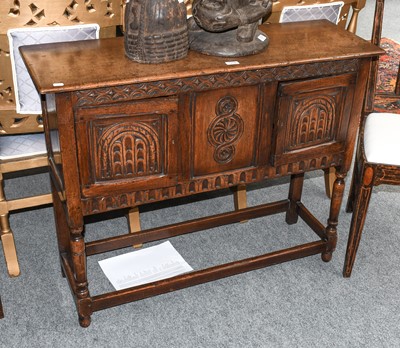 Lot 1296 - A 17th century style carved oak side cabinet,...