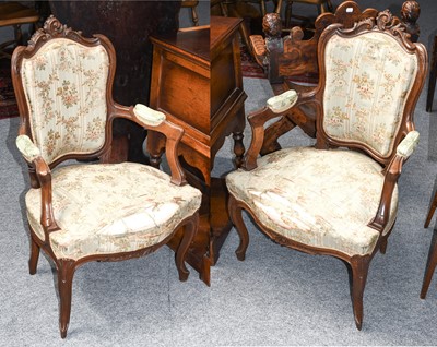 Lot 1290 - A pair of French style walnut armchairs