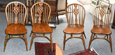 Lot 1300 - A set of four oak Windsor chairs