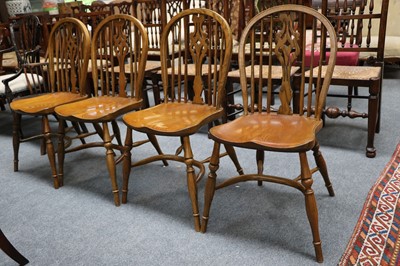 Lot 1300 - A set of four oak Windsor chairs