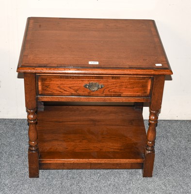 Lot 1303 - A crossbanded oak single drawer lamp table,...