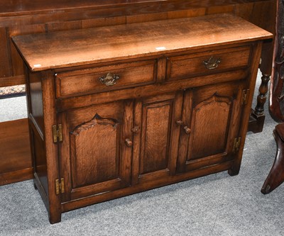 Lot 1293 - A Titchmarsh & Goodwin style oak side cupboard...