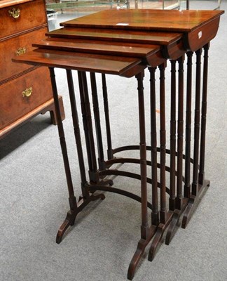 Lot 1254 - A Set of Four Rosewood Veneered Nesting Tables, late 19th/early 20th century, raised on elegant...