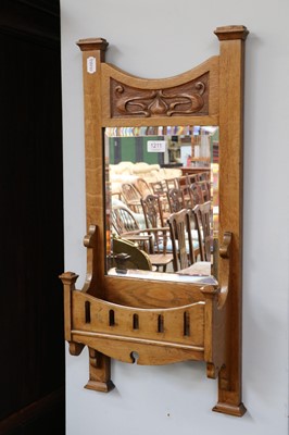 Lot 1211 - An Art Nouveau Oak Wall Mirror, with capped...