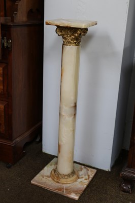 Lot 1225 - An Onyx and Gilt Metal Torchere, of Classical...