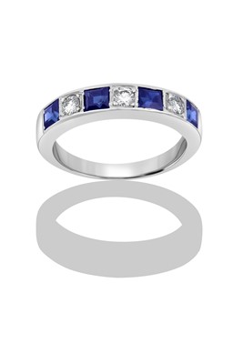 Lot 2349 - A Sapphire and Diamond Half Hoop Ring four...