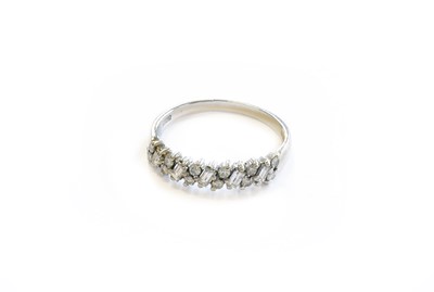 Lot 103 - An 18 Carat White Gold Diamond Half Hoop Ring,...