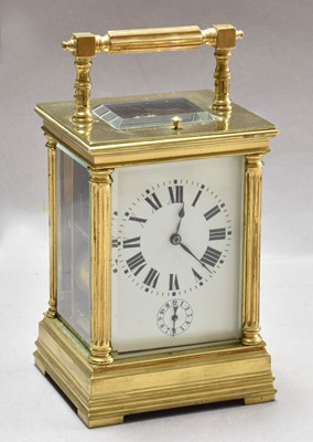 Lot 219 - A Brass Strike and Repeat Alarm Carriage Clock,...