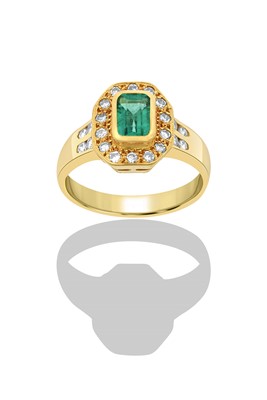 Lot 2402 - An 18 Carat Gold Emerald and Diamond Cluster...