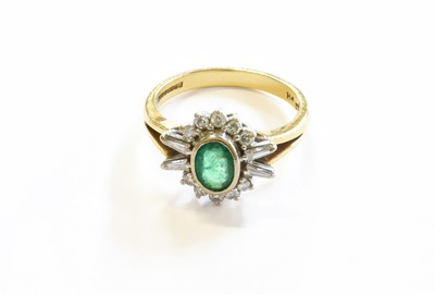 Lot 105 - An 18 Carat Gold Emerald and Diamond Cluster...