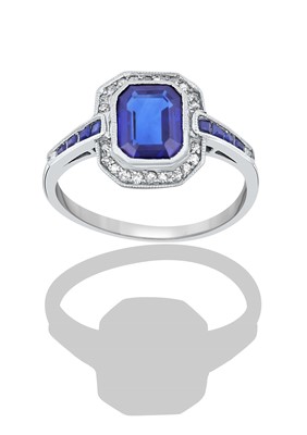 Lot 2358 - A Sapphire and Diamond Ring the emerald-cut...