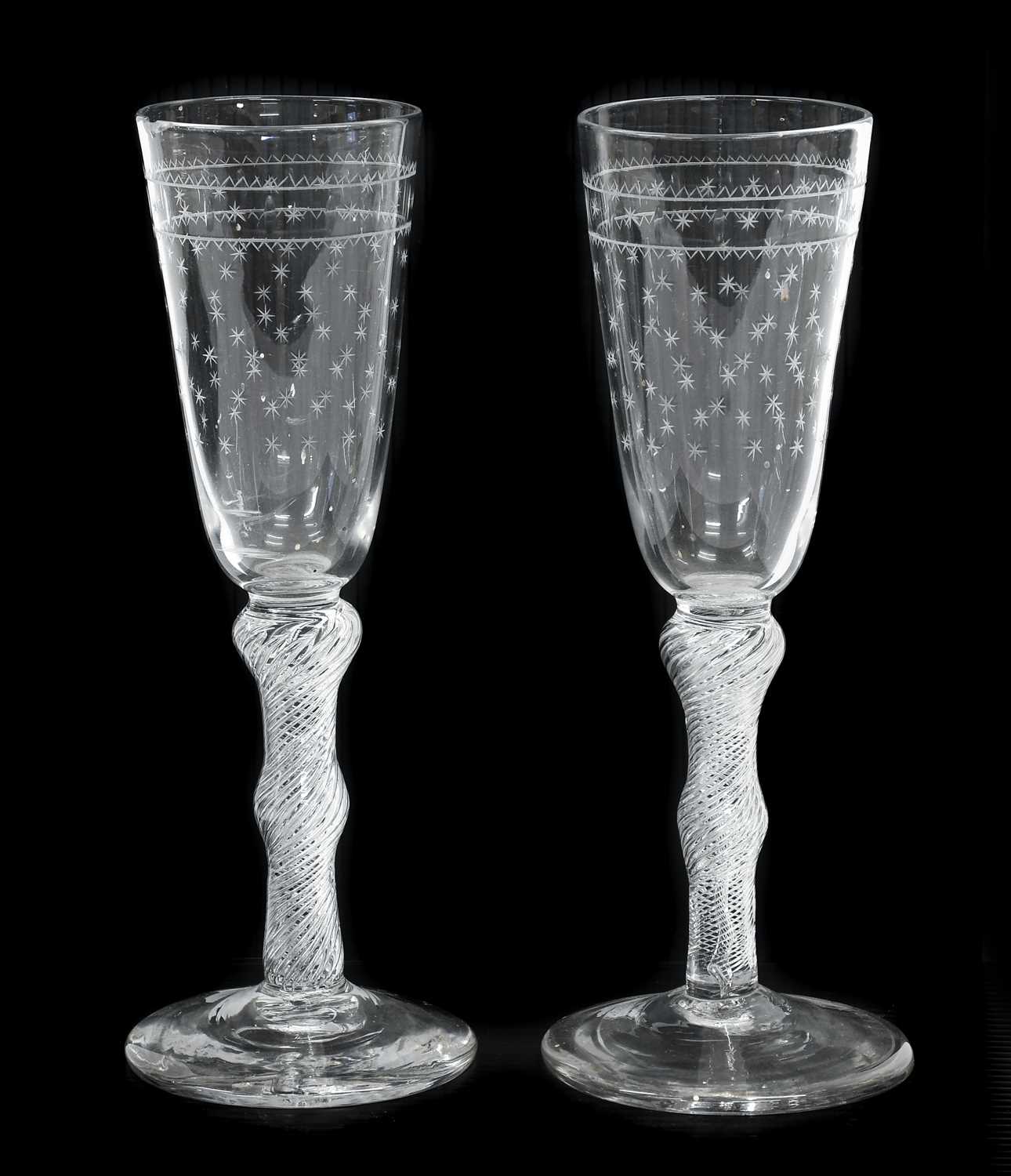 Lot 19 - A Pair of Ale Flutes, circa 1750, the rounded...