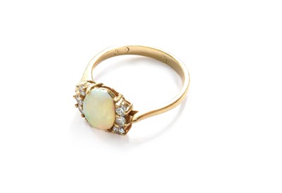 Lot 408 - An Opal and Diamond Ring, the oval cabochon...