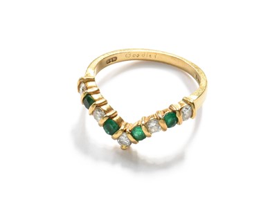 Lot 409 - An 18 Carat Gold Emerald and Diamond Wishbone...