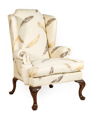 Lot 985 - A George III Style Wing-Back Armchair, modern,...