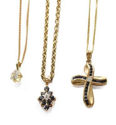 Lot 424 - A 9 Carat Gold Sapphire and Diamond Cross...