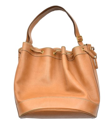 Lot 2267 - A Hermès Tan Leather Drawstring Bucket Bag,...