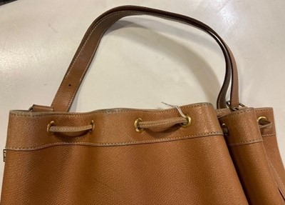 Lot 1089 - A Hermès Tan Leather Drawstring Bucket Bag,...