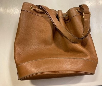 Lot 1089 - A Hermès Tan Leather Drawstring Bucket Bag,...