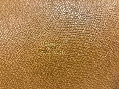 Lot 1089 - A Hermès Tan Leather Drawstring Bucket Bag,...