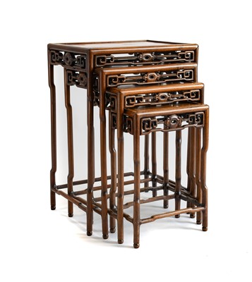 Lot 894 - A Set of Four Chinese Hardwood Nesting Tables,...