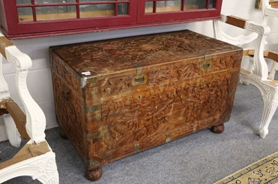 Lot 1183 - A Chinese Camphor Wood Chest, carved in relief...