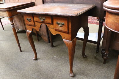 Lot 1313 - A George III Oak Lowboy, banded in mahogany,...