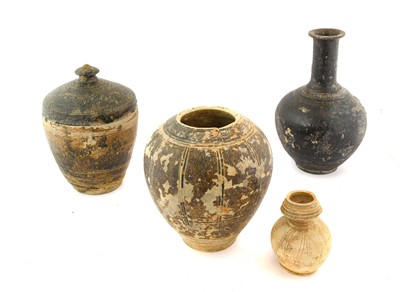 Lot 196 - A Khmer Brown Glazed Stoneware Jar and Cover,...