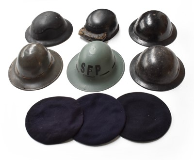 Lot 2219 - Nine Pieces of Second World War Headgear,...