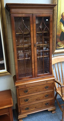 Lot 1143 - A Reproduction Walnut Bookcase, the glazed...