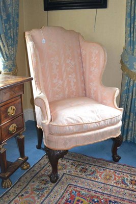 Lot 1268 - A 19th Century Wing-Back Armchair, recovered in pink silk damask, with flared sides and squab...