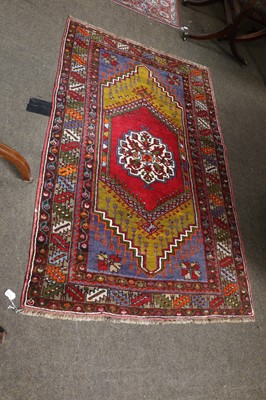 Lot 1114 - An Anatolian Prayer rug, the blood red field...