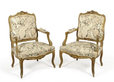 Lot 1269 - A Pair of Louis XV Style Gilt Gesso Open Armchairs, late 19th century, with needlework padded...