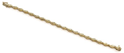 Lot 199 - A 9 Carat Gold Diamond Line Bracelet, length...