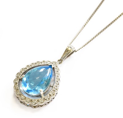 Lot 208 - A Blue Stone and Diamond Cluster Pendant on...