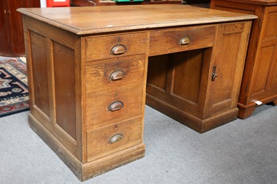 Lot 1127 - A Oak Kneehole Desk, early 20th century, 137cm...