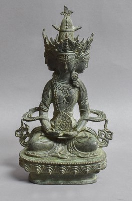 Lot 143 - A Sino Tibetan Bronze Buddha, raised on a...