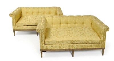 Lot 1274 - A Pair of Louis XVI Style Giltwood Sofas, upholstered in yellow silk damask, with rounded back...