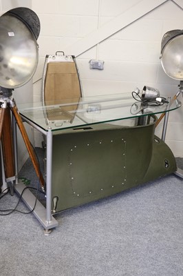 Lot 1300 - A Modern Glass Top Desk, formed from a section...