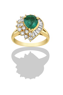 Lot 2400 - An Emerald and Diamond Cluster Ring the pear...