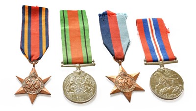 Lot 14 - A group of four World War II medals, War medal,...