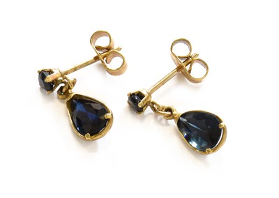 Lot 219 - A Pair of Sapphire Drop Earrings, a round cut...